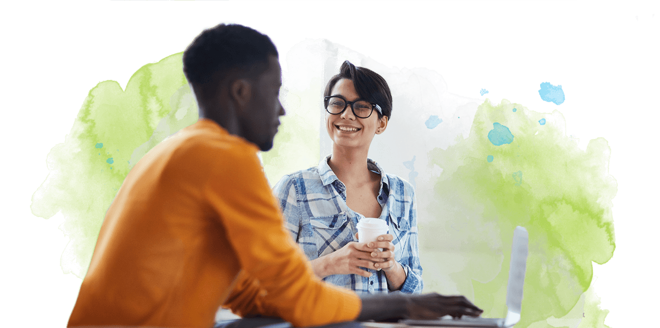 Coworkers in discussion over coffee