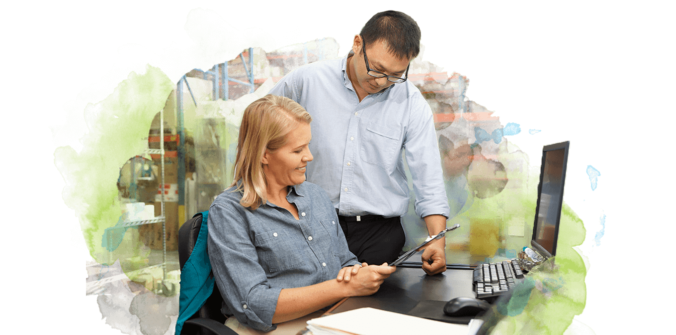 Employees conversing in warehouse